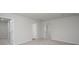 A spacious bedroom with multiple doorways, carpet floors, and neutral paint, creating a blank canvas for personalization at 737 Meadowbrook Ln, Summerville, SC 29486