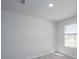 Bedroom with neutral carpet, white walls, and a window, offering a serene and calming space at 737 Meadowbrook Ln, Summerville, SC 29486