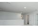 Open loft area with neutral walls, carpet, overhead lighting, and access to bathroom and bedroom at 737 Meadowbrook Ln, Summerville, SC 29486