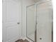 A modern shower with glass doors, white subway tile, and chrome fixtures, enclosed by a white door at 737 Meadowbrook Ln, Summerville, SC 29486