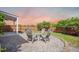 Backyard patio area featuring pavers and gravel with an outdoor seating area and a covered structure nearby at 743 Redbud Ln, Summerville, SC 29486