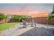 Backyard patio area featuring pavers and gravel with an outdoor seating area and a well-maintained wood fence at 743 Redbud Ln, Summerville, SC 29486