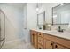 Modern bathroom featuring double sink vanity with granite countertop, contemporary fixtures, and a walk-in shower at 743 Redbud Ln, Summerville, SC 29486
