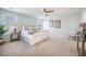 Bright bedroom with neutral tones, carpet, ceiling fan, and a comfortable king-size bed at 743 Redbud Ln, Summerville, SC 29486