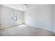 Bright bedroom with neutral tones, carpet, ceiling fan, and a large window at 743 Redbud Ln, Summerville, SC 29486