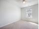 Bright bedroom with neutral tones, carpet, ceiling fan, and a large window at 743 Redbud Ln, Summerville, SC 29486