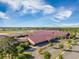 Overhead view of community school featuring lush landscaping and ample parking spaces under a blue sky at 743 Redbud Ln, Summerville, SC 29486