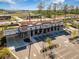Aerial shot of commercial building with Chick-fil-A, drive-through, parking spaces, landscaping and an American flag at 743 Redbud Ln, Summerville, SC 29486