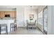Cozy dining area with modern lighting, bar stool seating, and kitchen access at 743 Redbud Ln, Summerville, SC 29486
