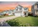 Traditional two-story home with a two-car garage, a well-kept lawn, and neutral siding at 743 Redbud Ln, Summerville, SC 29486