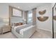 Serene bedroom with a padded headboard, neutral decor, and stylish wall art create a relaxing atmosphere at 760 Meadowbrook Ln, Summerville, SC 29486