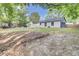 Large backyard with wooded area, offering plenty of space for outdoor activities at 7674 Chippendale Rd, North Charleston, SC 29420