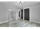 Bright bedroom featuring an empty space with luxury vinyl plank flooring and modern ceiling fan at 7674 Chippendale Rd, North Charleston, SC 29420