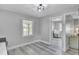 Bright dining area with windows and access to the laundry room with washer and dryer at 7674 Chippendale Rd, North Charleston, SC 29420