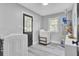 Well-lit laundry room features a washer, dryer, and convenient storage shelves at 7674 Chippendale Rd, North Charleston, SC 29420