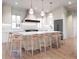 Modern kitchen with a large island, pendant lighting, and sleek, high-end appliances at 814 Palm Blvd, Isle of Palms, SC 29451
