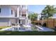 Inviting backyard pool with lounge seating, surrounded by a well-maintained yard and modern home design at 814 Palm Blvd, Isle of Palms, SC 29451