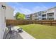 Large grassy backyard enclosed by a wooden fence, perfect for outdoor activities and relaxation at 9088 Parlor Dr, Ladson, SC 29456