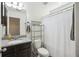 Bright bathroom featuring a vanity with granite countertop and a shower with a white curtain at 9088 Parlor Dr, Ladson, SC 29456