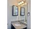 Bathroom featuring a vanity with granite countertop and a mirror with an overhead vanity light at 9088 Parlor Dr, Ladson, SC 29456