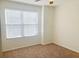 Bedroom with a ceiling fan, a window, and neutral carpet at 9088 Parlor Dr, Ladson, SC 29456