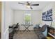 Bedroom with a ceiling fan, a window, desk, a keyboard and a gray couch at 9088 Parlor Dr, Ladson, SC 29456