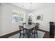 Cozy dining area with large window, modern table set and elegant decor at 9088 Parlor Dr, Ladson, SC 29456