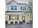 Charming two-story home featuring a welcoming front porch and well-maintained landscaping at 9088 Parlor Dr, Ladson, SC 29456