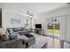 Comfortable living room with a large sectional sofa, stylish rug, and a view to the fenced yard at 9088 Parlor Dr, Ladson, SC 29456