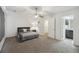 Main bedroom with a ceiling fan, with an adjoined bathroom at 9088 Parlor Dr, Ladson, SC 29456