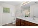 Well-lit bathroom boasts double sinks, a large mirror, and tasteful decor for a modern, clean feel at 9747 Seed St, Ladson, SC 29456