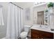 Bathroom with a tub, shower and a vanity with modern fixtures providing both style and function at 9747 Seed St, Ladson, SC 29456