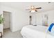 A cozy bedroom featuring a walk-in closet, neutral tones, and a ceiling fan for year-round comfort at 9747 Seed St, Ladson, SC 29456