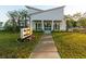 Club of Mckewn modern architecture with a manicured lawn and flower beds in the entryway at 9747 Seed St, Ladson, SC 29456