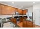 Well-equipped kitchen with wood cabinets, stainless steel appliances, and granite countertops at 9747 Seed St, Ladson, SC 29456