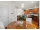Cozy eat-in kitchen area featuring a wooden table and chairs with a view of the kitchen at 9747 Seed St, Ladson, SC 29456