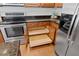 Kitchen featuring stainless steel appliances and dark countertops with cabinet storage at 9747 Seed St, Ladson, SC 29456