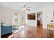 Comfortable living room with hardwood floors, ceiling fan, and easy access to the backyard at 9747 Seed St, Ladson, SC 29456