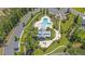 An aerial view showcases the community pool, clubhouse, playground and surrounding green spaces at 9829 English Elm St, Ladson, SC 29456