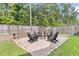 Backyard featuring a cozy seating area with chairs around a modern fire pit perfect for entertaining at 9829 English Elm St, Ladson, SC 29456