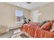 Bright bedroom with a window and stationary exercise bike, well-lit with natural light at 9829 English Elm St, Ladson, SC 29456
