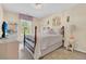 Cozy bedroom with chandelier, window, and whimsical decor at 9829 English Elm St, Ladson, SC 29456