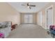 Large bonus room provides flexible living space with French doors to the backyard at 9829 English Elm St, Ladson, SC 29456