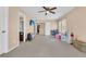 Spacious bonus room for flexible use with a tv, toys, and natural light at 9829 English Elm St, Ladson, SC 29456
