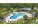 This overhead shot showcases the community pool, clubhouse, and surrounding landscape at 9829 English Elm St, Ladson, SC 29456