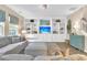 Comfortable living room features built-in shelving, plush seating, and modern decor elements at 9829 English Elm St, Ladson, SC 29456