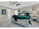 The main bedroom includes an ensuite bathroom, a ceiling fan, and plenty of natural light at 9829 English Elm St, Ladson, SC 29456