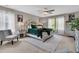 Comfortable main bedroom features a ceiling fan, decorative rug, and natural light at 9829 English Elm St, Ladson, SC 29456