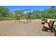 Outdoor playground with benches and swings for children at 9829 English Elm St, Ladson, SC 29456