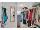 Well-organized walk-in closet with mirror and ample storage space for clothes and shoes at 9829 English Elm St, Ladson, SC 29456